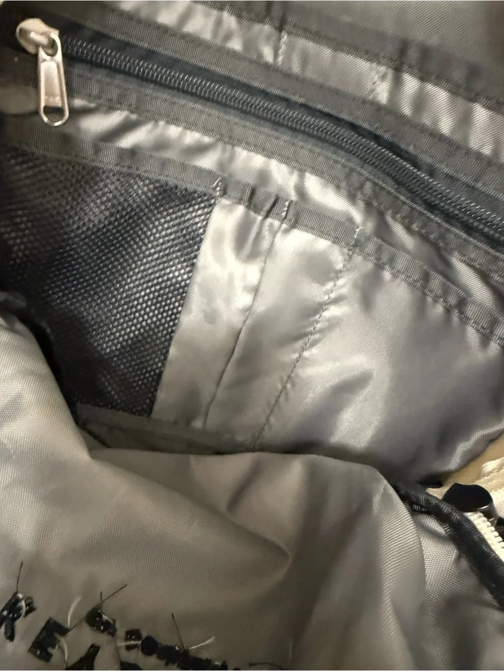 The North Face Two-Tone Beige and Black Backpack with Bungee Front